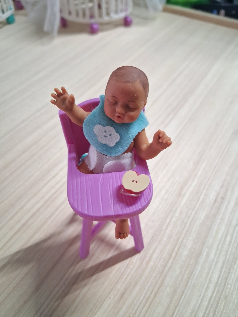 Mini Baby Doll in Purple Highchair with Blue Bib